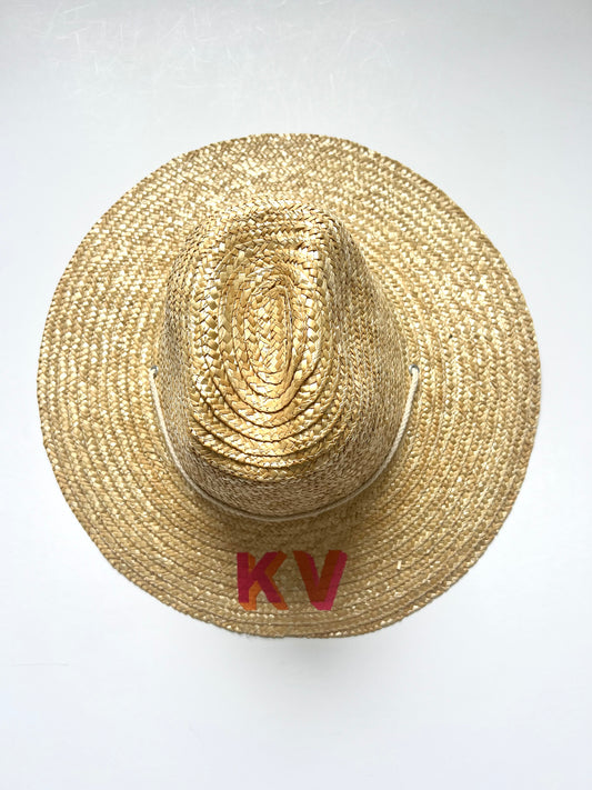 Kat font with orange and tropical pink thread inverse.