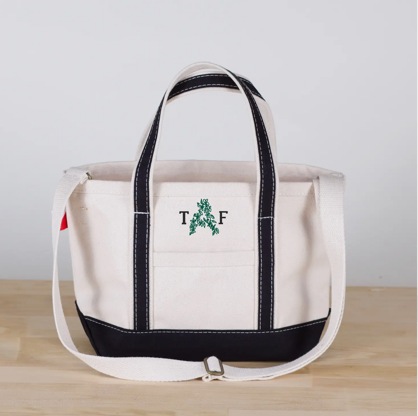 floral font with simple font in backyard green and black thread
