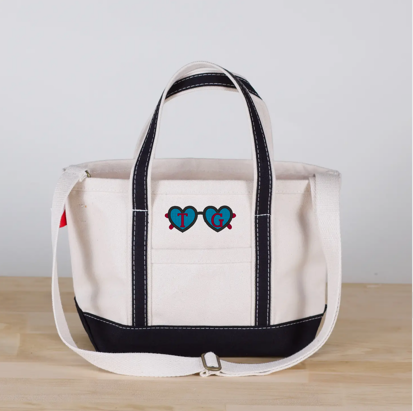 sunglass motif with simple font in black, country red and turquoise