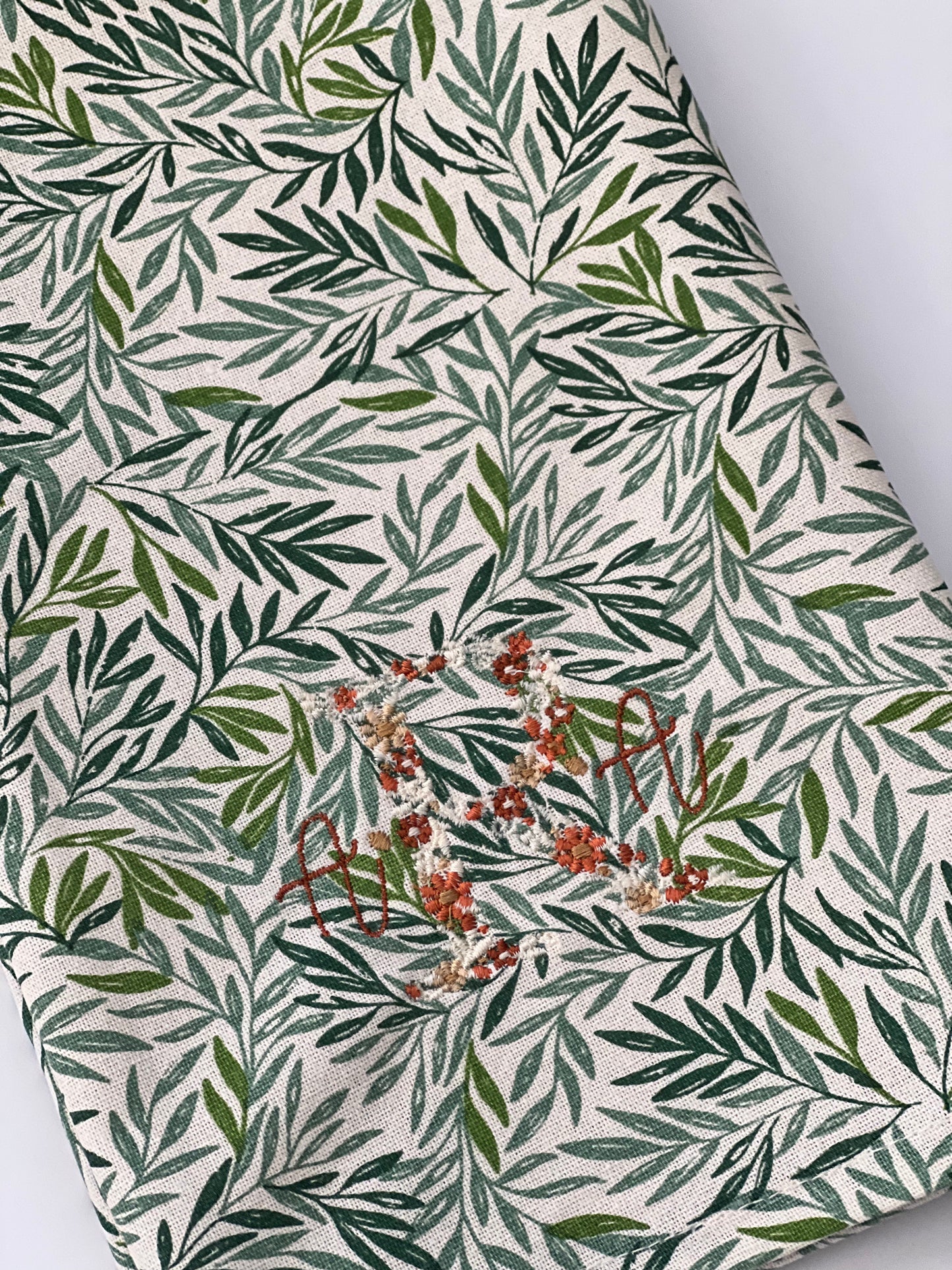Floral initial with serena font in fall color palette