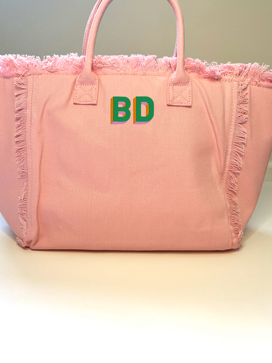 QT font with kelly green, orange and pink thread